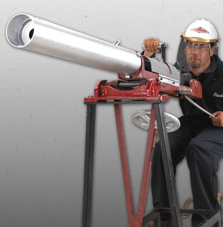 A person demonstrating the operation of the Kiln gun.