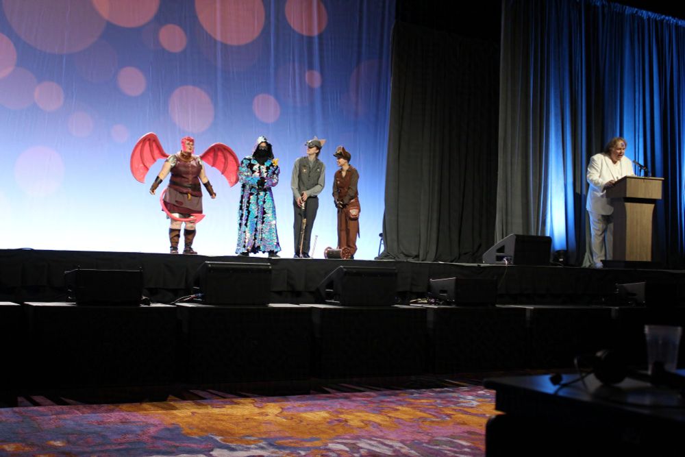 Seattle 2025 worldcon masquerade novice to notice nimora in stage waiting for award 