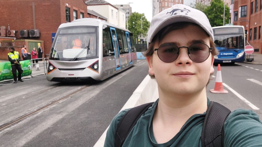 A selfie of me in front of Coventry's Very Light Rail tram