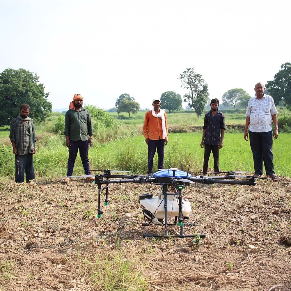 Image of a group of five men in India using a drone