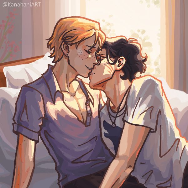 Two boys on a bed about to kiss