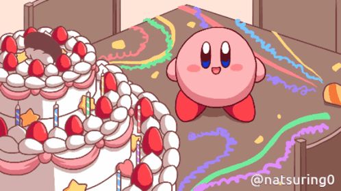 a cartoon of kirby standing next to a birthday cake with candles