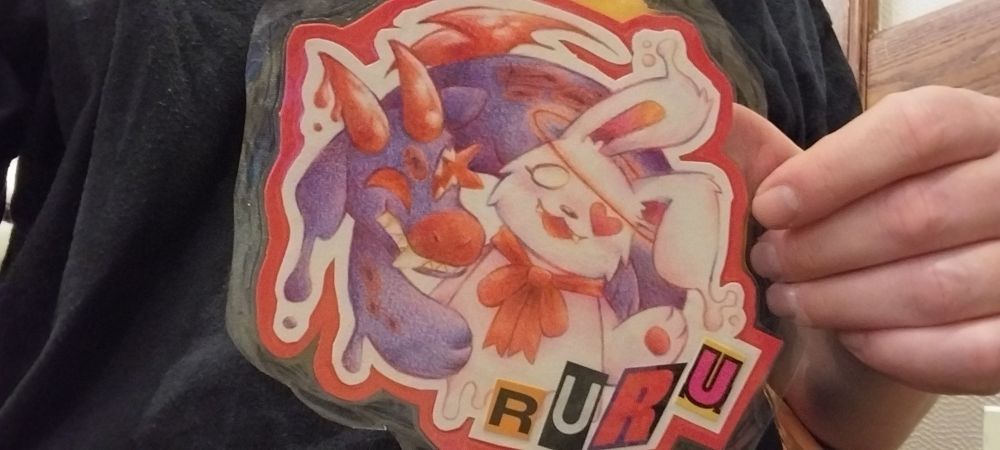 A rabbit and strange spore creature wave at you from the frame. they are both melty and jovial.

Terrorkin leans around Ashley, a fork-tongued mouth where one of its eyes could be, pools of spores coalesce in patches in its surface.

Ashley Ru's left eye is transformed into a heart and her red halo shines brightly. She's wearing a bright red bow and a friendly smile.