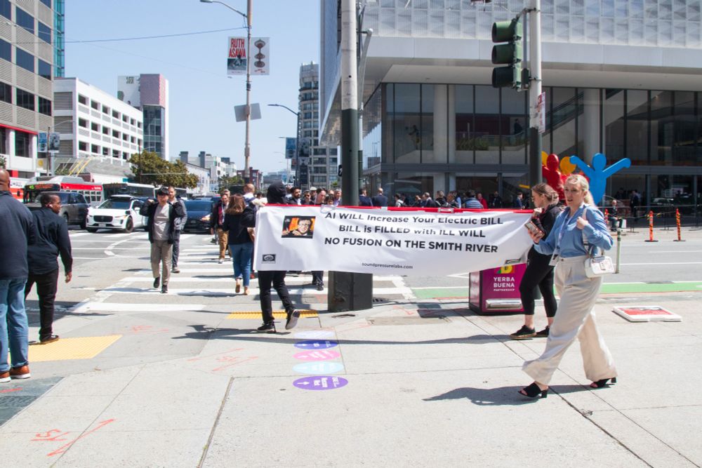 Same sign on a street corner, in front of a crosswalk