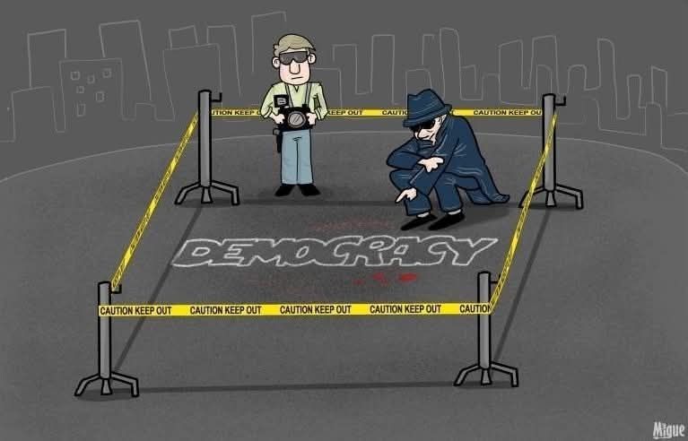 Two crime scene investigators at a taped-off area, one standing, looking on, the other kneeling over a murder-victim chalk outline of the word "DEMOCRACY" 