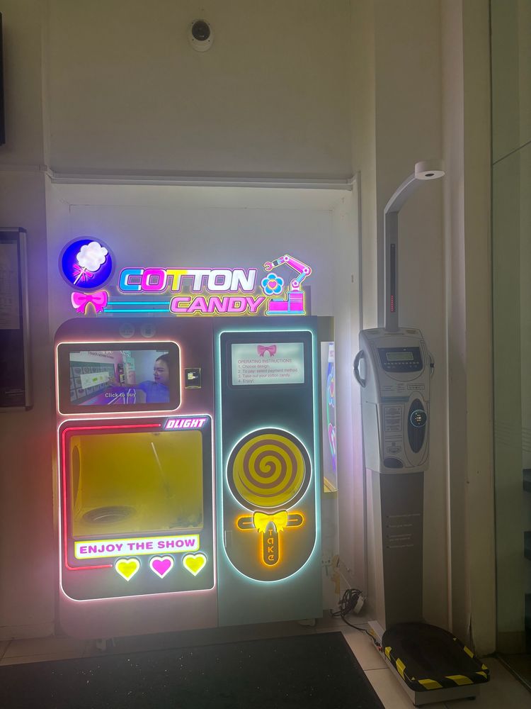 Cotton candy machine next to body vitals machine 