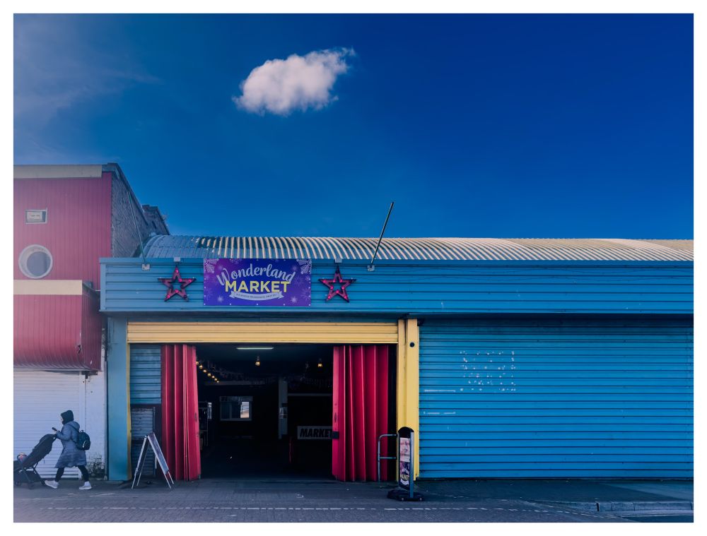 Wonderland Market
Blue sky 
Woman with push chair 