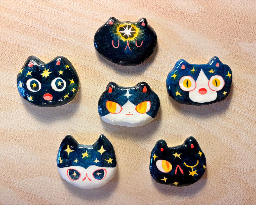 galaxy cats made out of clay. 
they have stars in their fur 