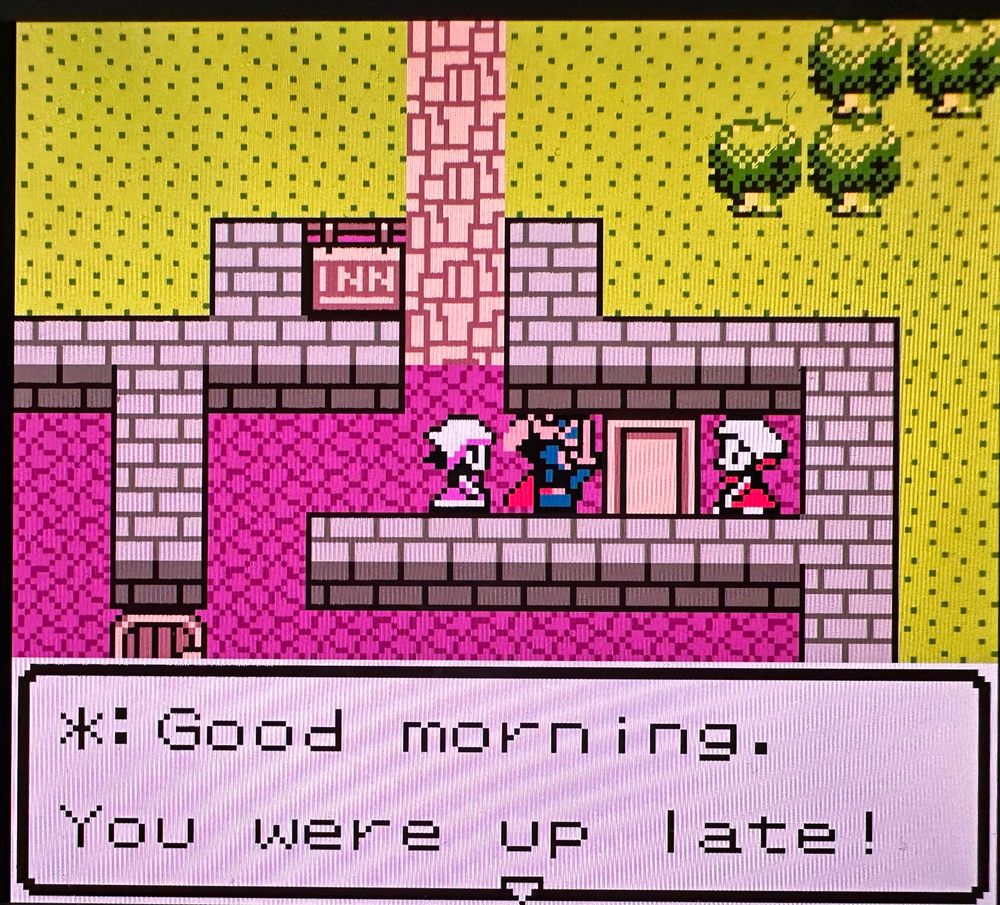 The same innkeeper except her text now reads “Good morning. You were up late!”