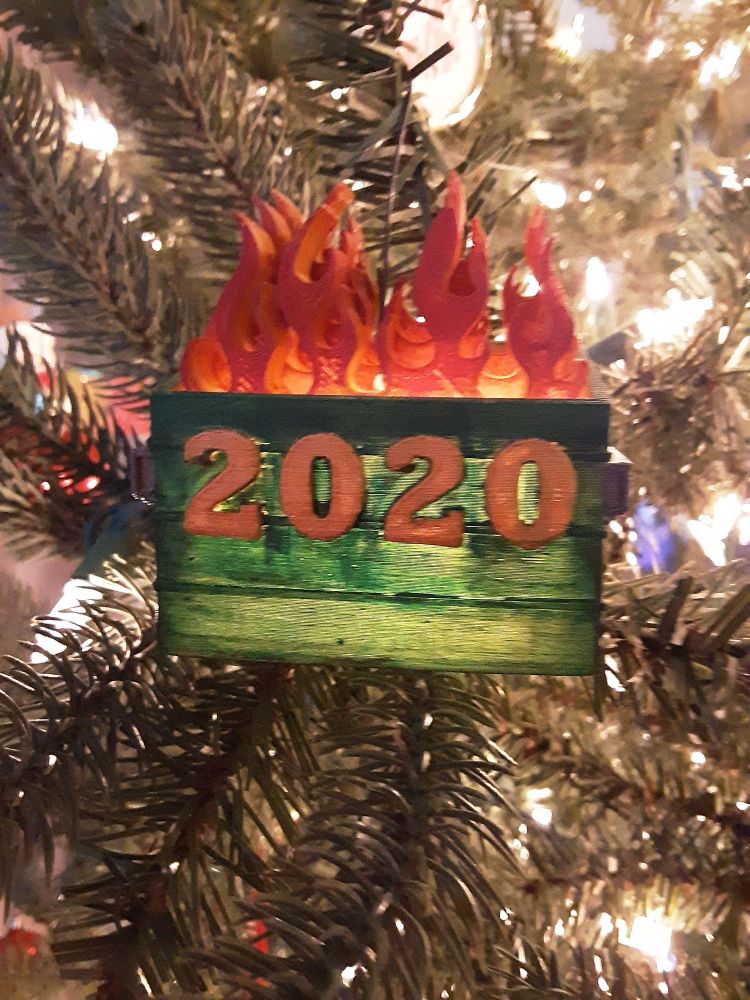 Ornament of a dumpster fire labeled 2020.