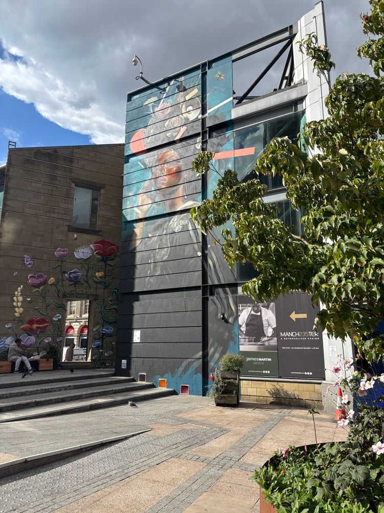 Flowers and a lady murals near Deansgate in Manchester.