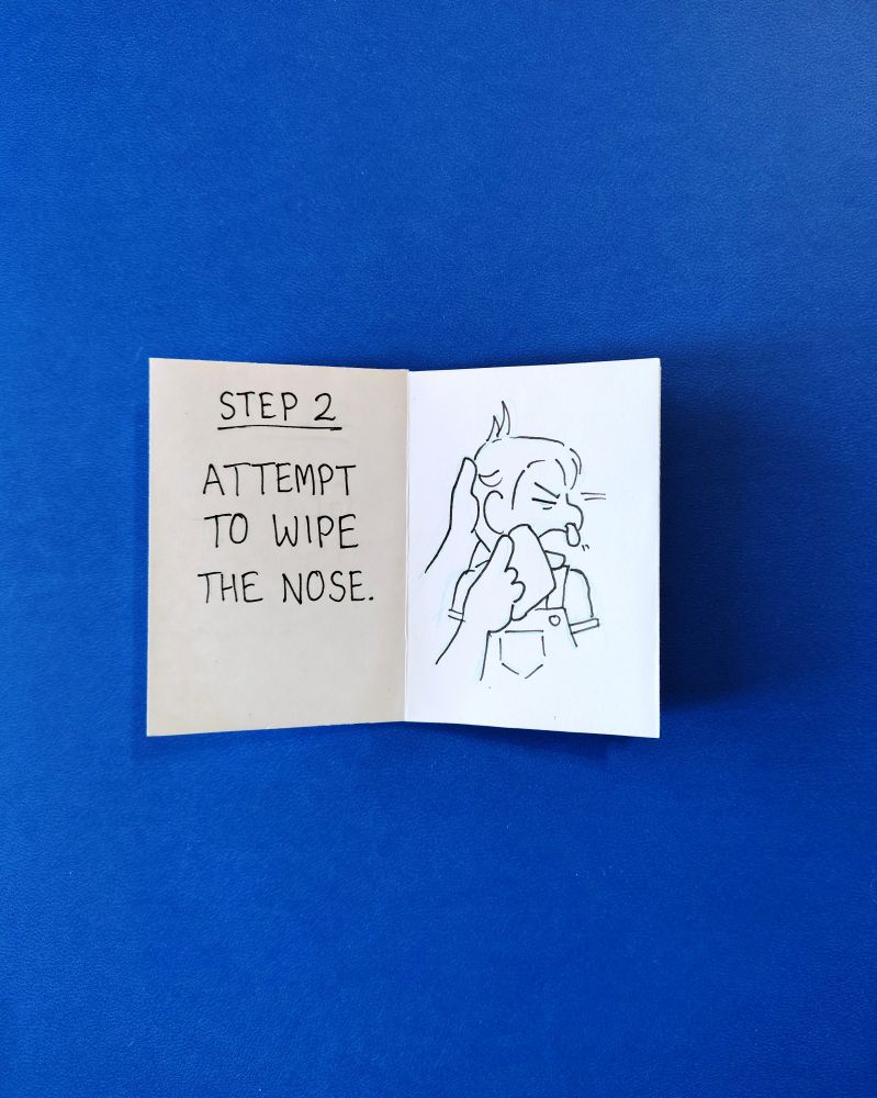 Step 2: Attempt to wipe the nose.
Baby moves head away