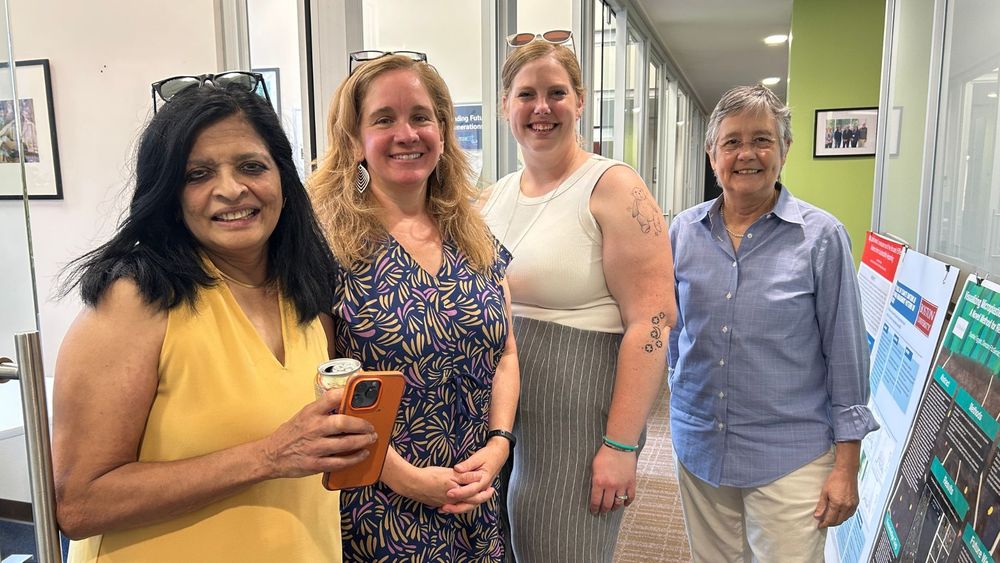 IGS faculty and staff pose in the office.