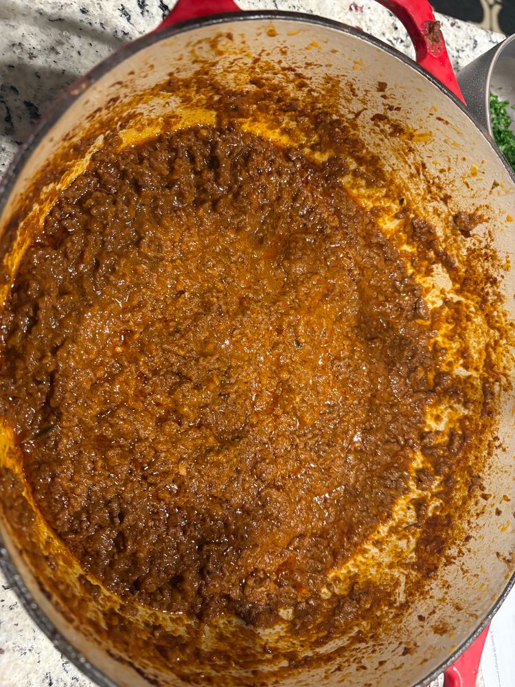 A pot full of fresh bolognese sauce that 