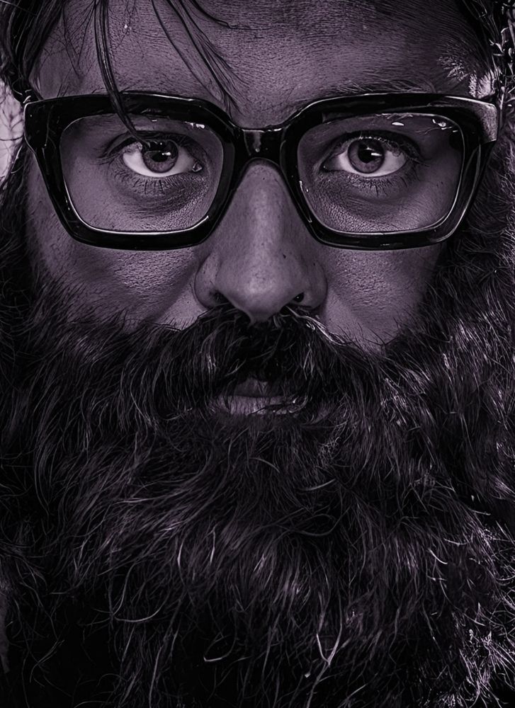 OP looking intense behind glasses & beard