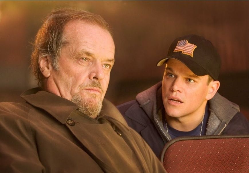 Jack Nicholson and Matt Damon sitting in a movie theater - The Departed 