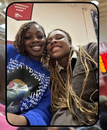 jhanya and brianna taking a selfie inside a gymnasium 