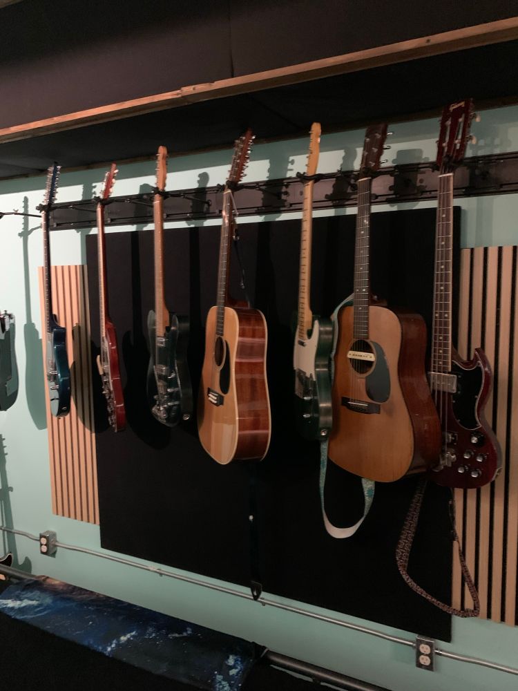 Guitars on the wall at Great Horned Audio