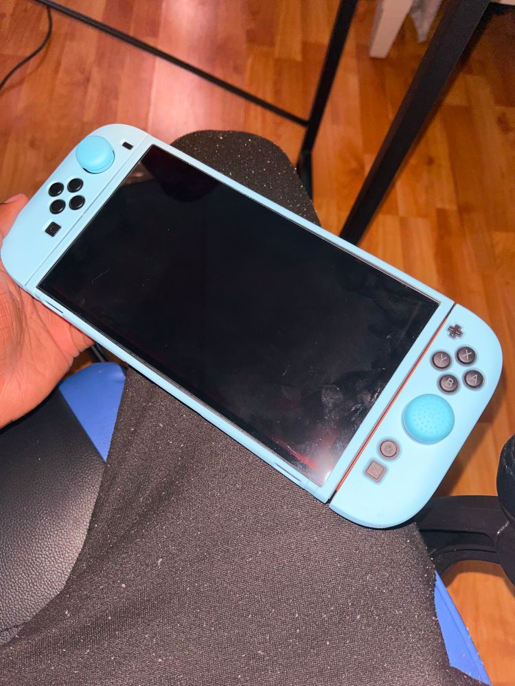 2nd picture of my holding my customized Nintendo Switch 2