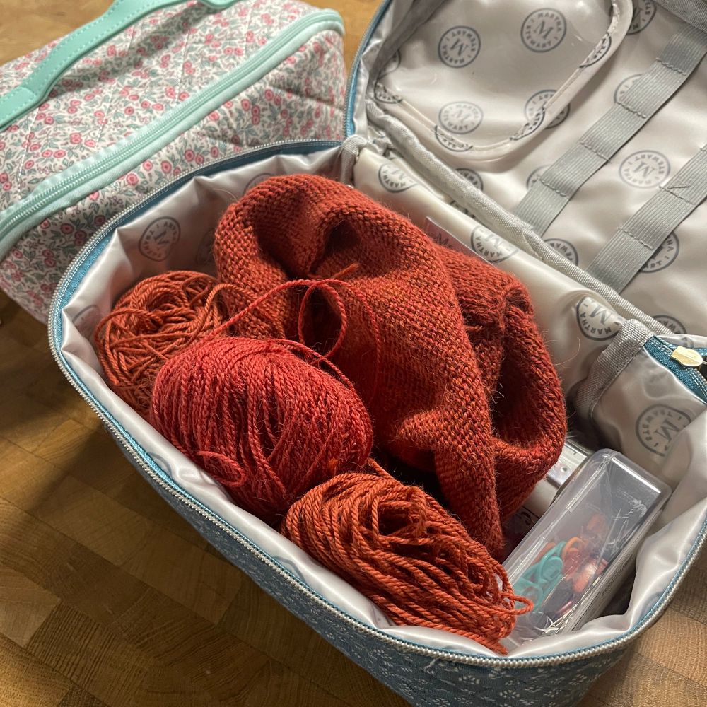 My red Poppy Tee project from Petite Knits sitting inside one of my new Project Bags. It’s the larger one with blue and white diamond quilt finishes. 