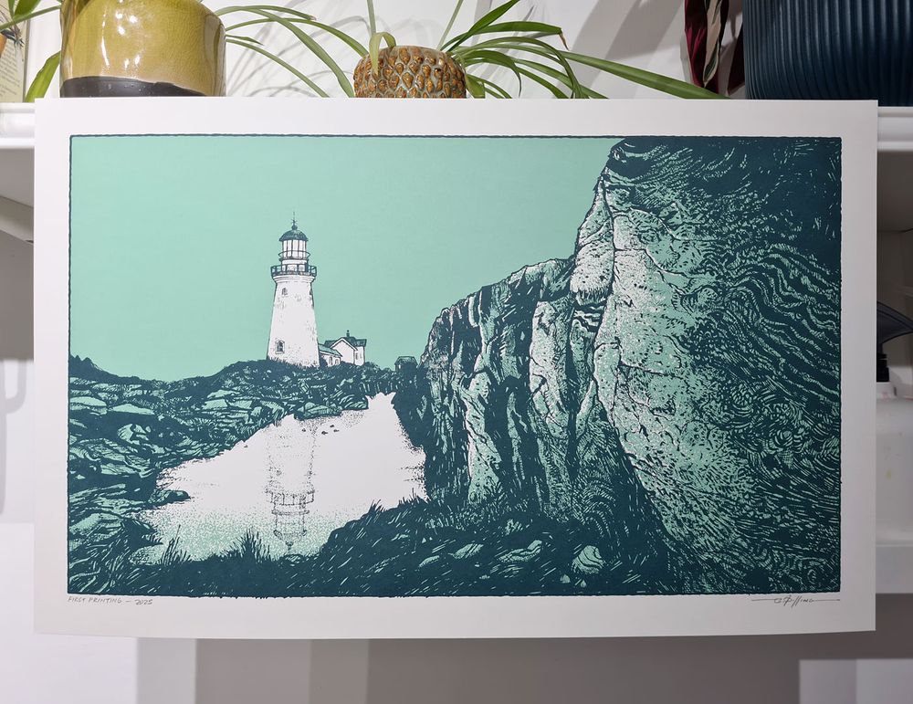 Screenprinted artwork of a lighthouse and its reflection in the shoreline with large textured rocks in the foreground, in green and dark blue.