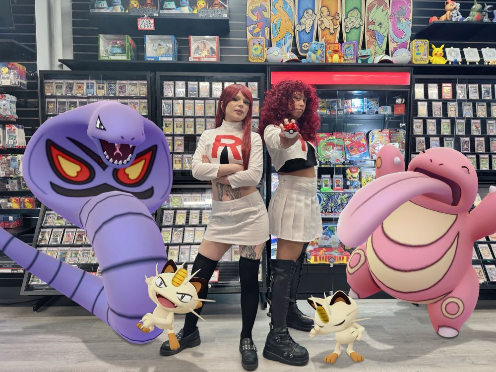 Two amazing cosplayers dressed as Jessie from Team Rocket pose with her Kanto team during the launch of the Pokémon TCG Destined Rivals release party at Nxt Legaci. This party was held in their store off of Times Square, New York City. The perfect place to steal some Pokémon in all the card chaos! (Pokémon GO #GOSnapshot)