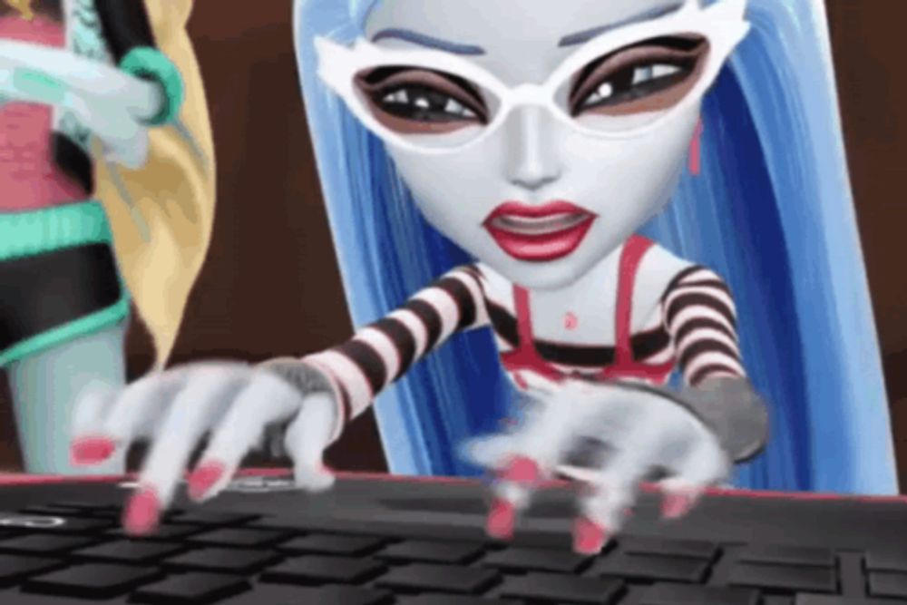 a monster high character is typing on a laptop computer