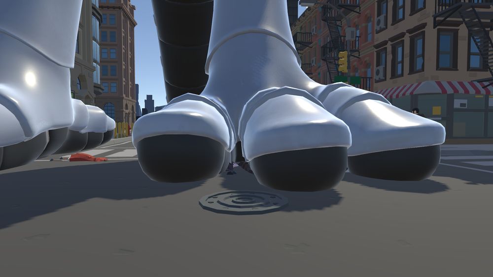 One of the synth's paws, planted firmly on a road. There are a few tiny people visible.