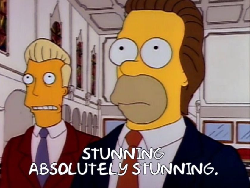 Karl (with a K) and Homer from the Simpsons. Homer has hair in this one. They're both staring in awe at something just off camera (could be a curry battered sausage). The caption reads: "Stunning. Absolutely stunning."