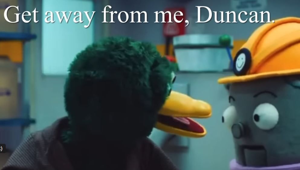 Duck from Don't Hug Me I'm Scared yelling in the face of a horrible little freak wearing a hard hat. The caption reads: "Get away from me, Duncan."