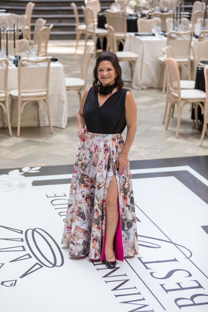 Associate publisher of Minnesota Bride Magazine, Brooke Beise, wearing a custom skirt design for the 30th-Anniversary "Best of Bride" Awards Gala; commissioned in spring/summer 2023. 

The skirt features a 3/4-circle floor-length cut with a collage of the first 30 MN Bride magazine covers, printed onto a heavyweight bridal satin. Other features include in-seam pockets, elastic waistband, and a magenta poly-satin lining.