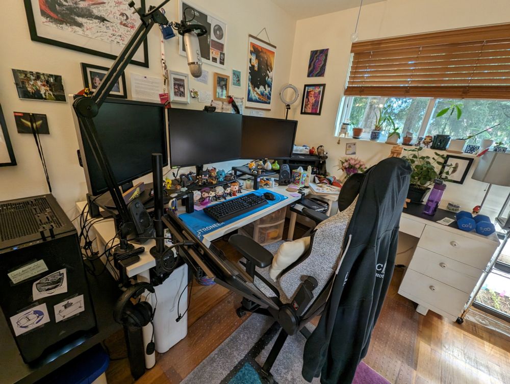 My messy desk space with 3 monitors & a Cintiq attached to a clunky 63" IKEA desk table I found in like 2010 in front of somebody's house with a "FREE" sign and my then-bf and I walked it like 9 blocks back home