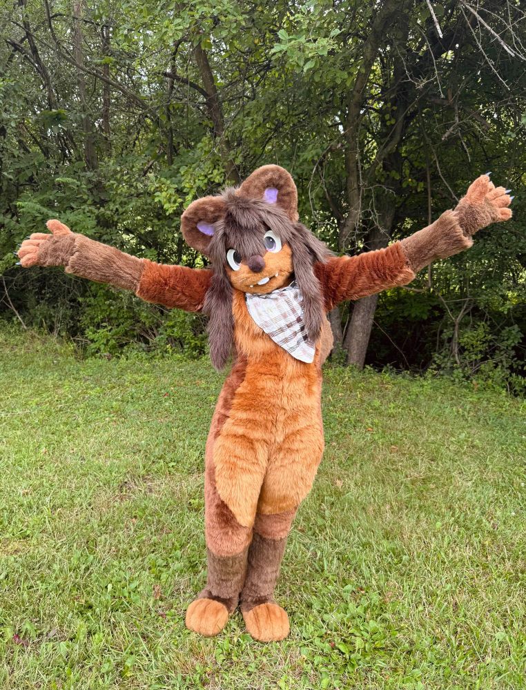 Petrichor with arms out in the forest 