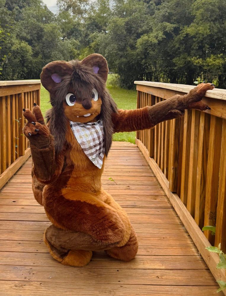 Petrichor with arm out posing on bridge 2