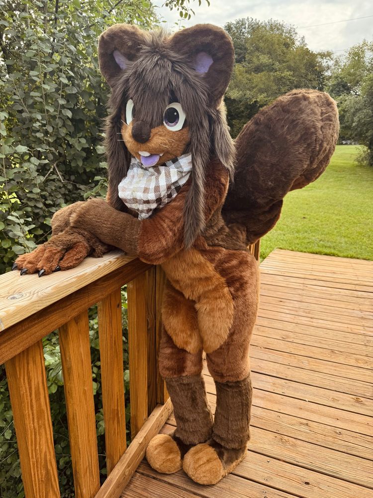 Petrichor with arms crossed posing on bridge 1