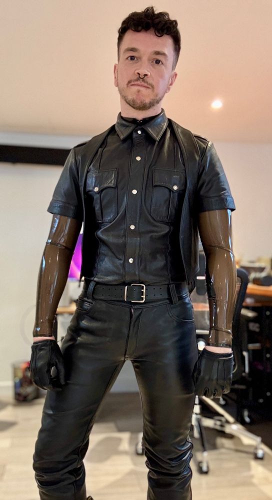 Me in leather trousers, top and gloves, with a Smokey transparent rubber top underneath. 
