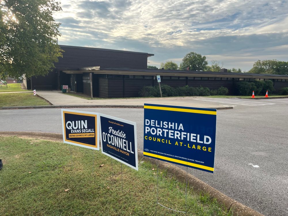 Yard signs for Quin Segall, Freddie O’Connell, and Delishia Porterfield in front of the Cleveland Park community center polling place in East Nashville! The sky is a beautiful web of early-morning clouds.