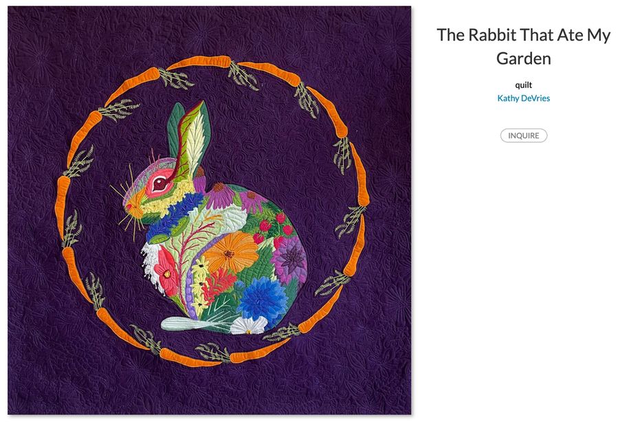 A quilt-patterned cottontail rabbit made up of several garden plants, surrounded by a circle of carrots. The background is a rich purple with further quilting details.