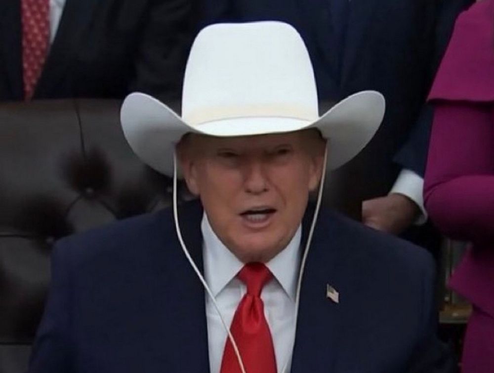 Trump in large cowbow hat