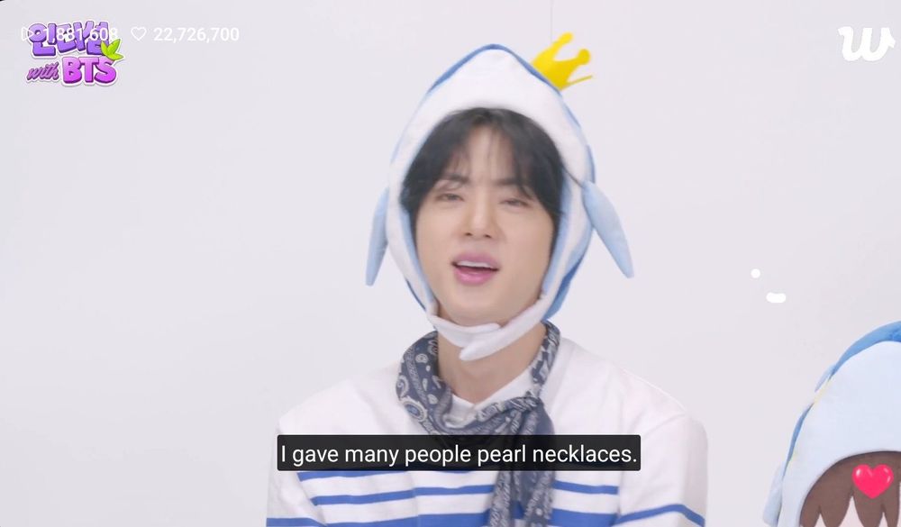 screenshot of Jin's recent live

He's wearing a supertuna hat and saying "I gave many people pearl necklaces" referencing gifts in the In the Seom game