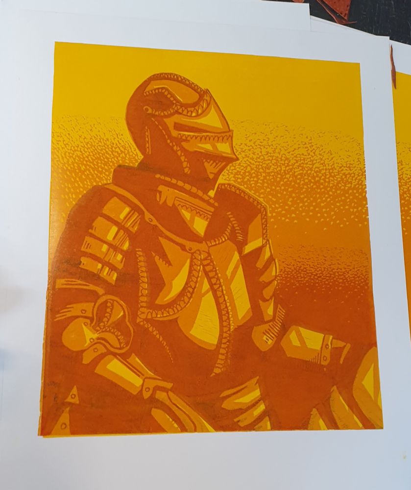 A lino print. It shows a knight.
The tree colors are yellow, orange, and darker orange 

