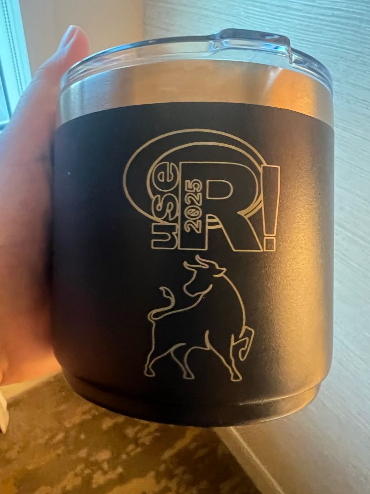 Duke and useR2025 logo in the cup. 