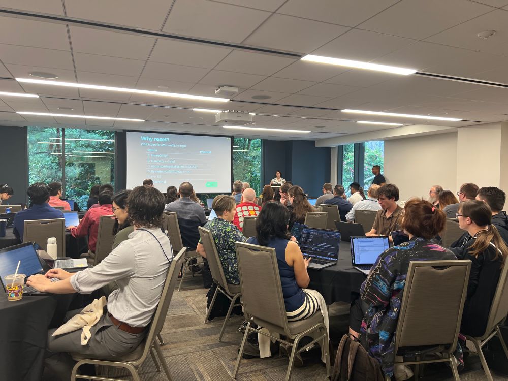 Attendees with their computer and Shannon teaching