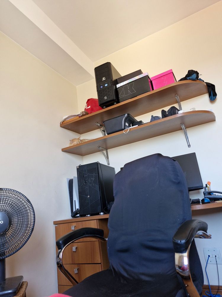 My PC desk with a stealth cat sleeping 