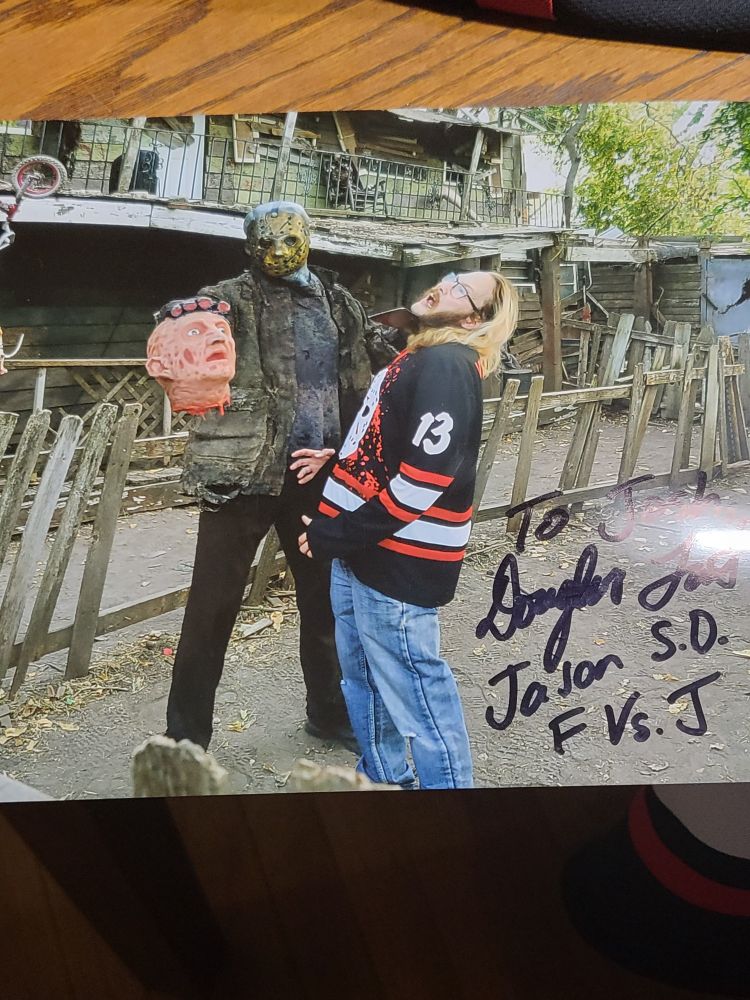 Signed photo of a blond man getting slashed by Jason Vorhees 