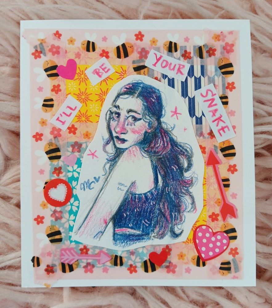 pink and blue colored pencil drawing of samia cut out and pasted onto a collage-style background. behind her is some patterned origami paper, heart stickers, bee washi tape, and the words "i'll be your snake" pasted on.
