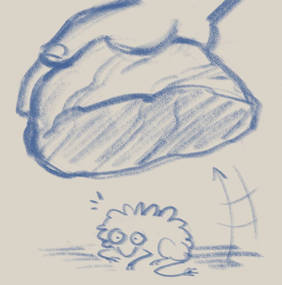 a hand lifts a rock, revealing some sort of little creature, which looks startled