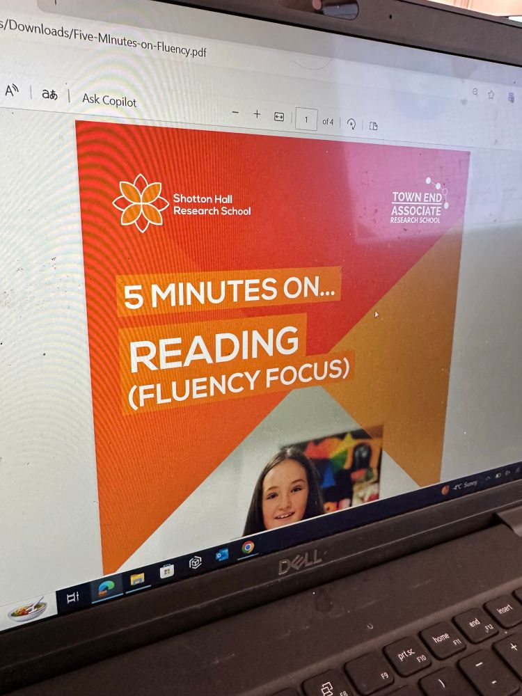 A computer screen with an orange title page from a learning course about teaching reading fluency