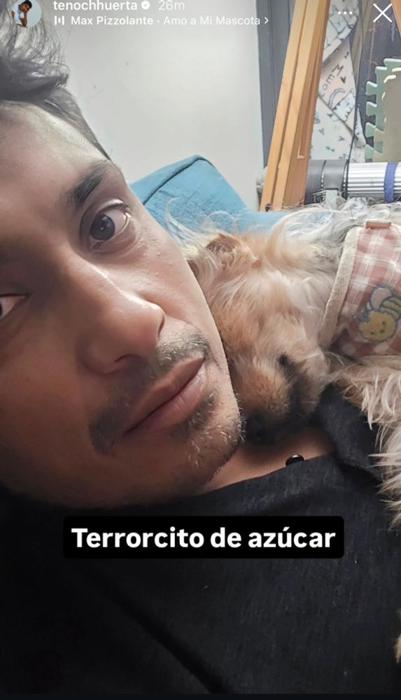 Tenoch Huerta cuddling his dog terror