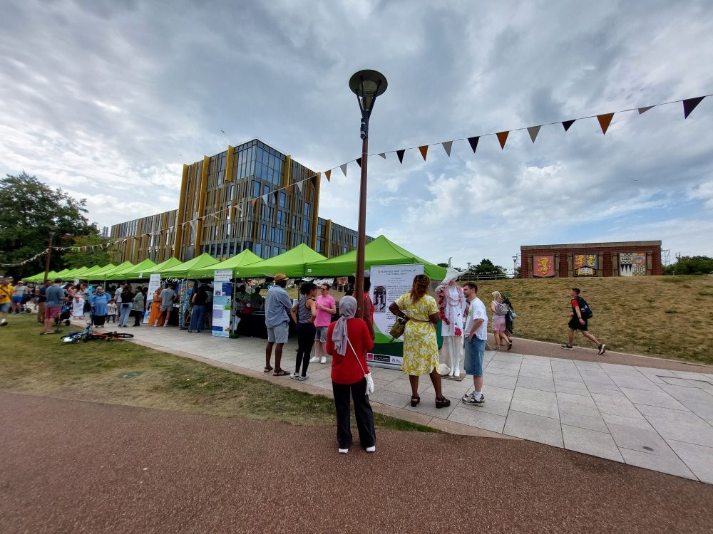 People at an outdoor education festival 
